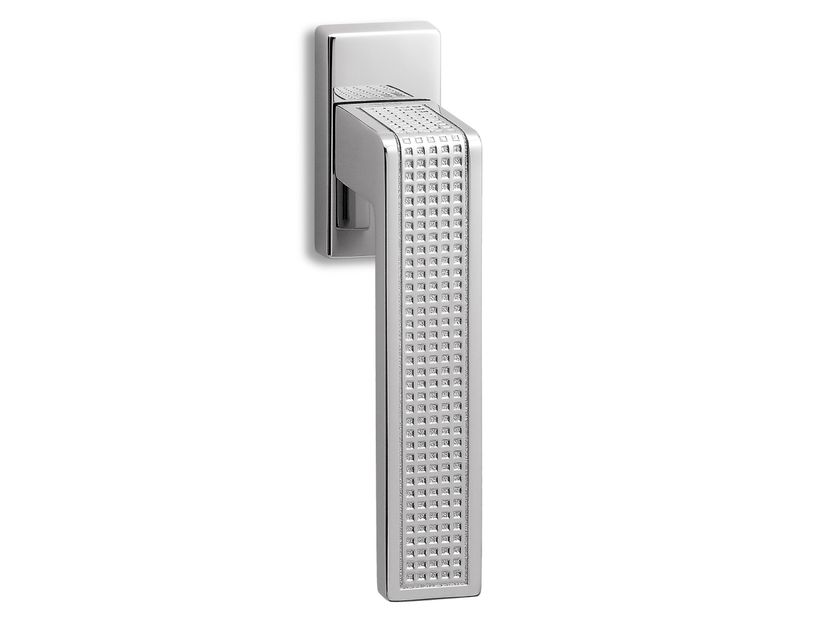 Ento
TECA
Brass window handle on rose